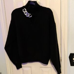 Elegant Black Turtleneck Sweater with Silver Chain Accent